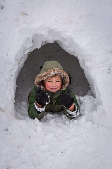 Tyler Bray (7) in an igloo having the time of his life in Glenrothes on Friday, March 2 2018