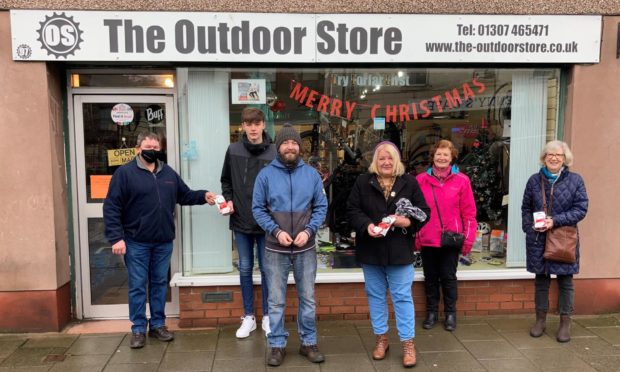 Adrian White (Richardsons newsagent), Lewis Young (Paper deliverer), Chris Smeaton (Bike shop owner), Kathryn Pattullo (FCC member), Councillor Lynne Devine and Charlotte Douglas (FCC member)