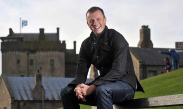 Author Neil Forsyth next to Broughty Castle.