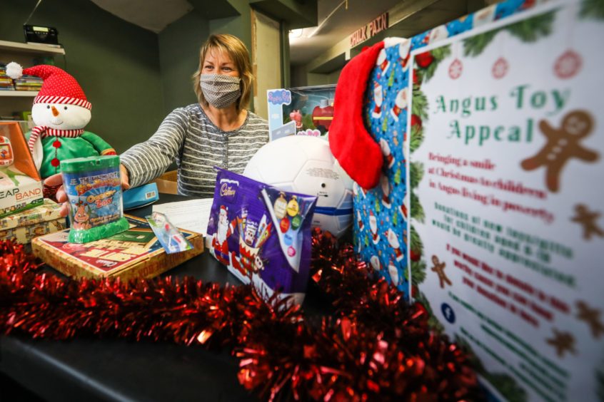 Sharon Spink prepares a parcel for a child at Christmas.