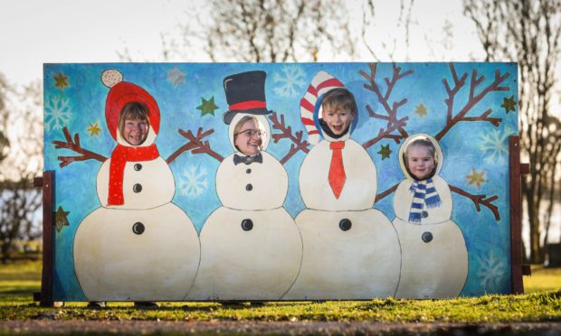 Fiona Kenny, Lisa Kenny, with Jack Milne, 9 and Sophie Milne, 5 getting in the festive spirit at Monikie.