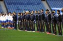 The players line up for the anthems at an empty Murrayfield before Scotland play France in the Autumn Nations Cup.