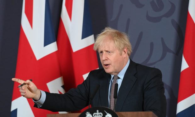 Britain's Prime Minister Boris Johnson speaks during a media briefing in Downing Street.