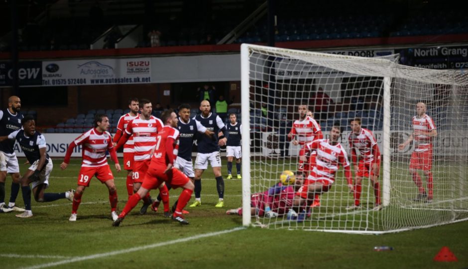 Dundee's Jonathan Afolabi (second from left) sees his late effort find the net to deny Bonnyrigg.