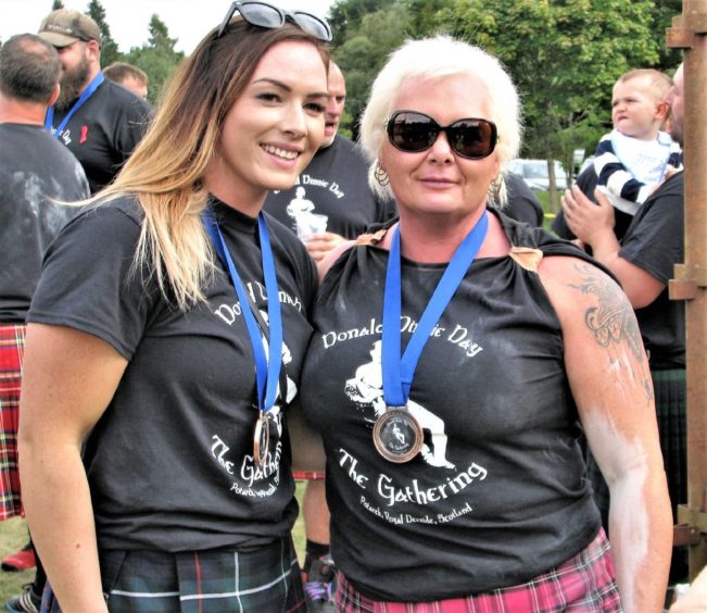 Susan Holland-Keen (right) and daughter Leigh visiting the Dinnie Steens during a strongman gathering in 2018. 