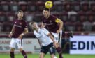 Hearts' Craig Halkett and Dundee's Danny Mullen (L) pictured during opening match of the season.