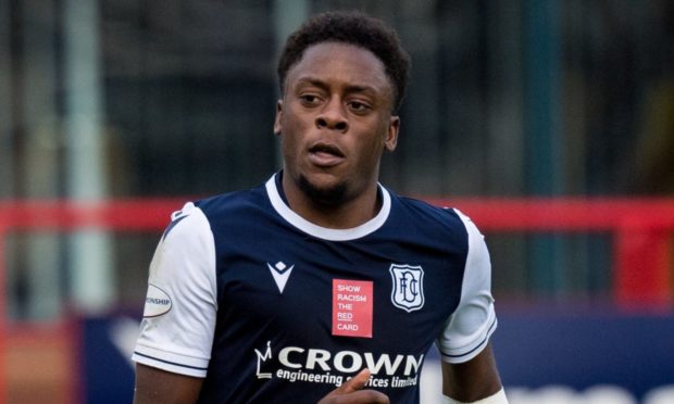 DUNDEE, SCOTLAND - OCTOBER 24: Dundee's Jonathan Afolabi receives treatment for an arm injury during a Scottish Championship match between Dundee and Greenock Morton at Dens Park, on October 24, 2020, in Dundee, Scotland. (Photo by Ross Parker / SNS Group)