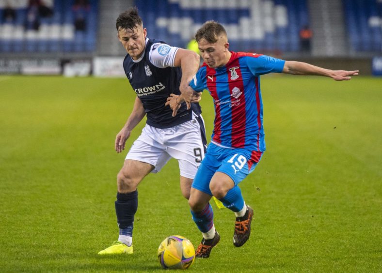 Kai Kennedy in action for Inverness up against Dundee ace Danny Mullen.