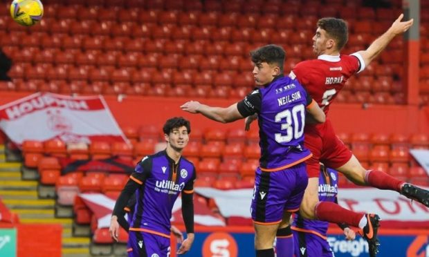 Lewis Neilson (No 30) in the thick of the action against Aberdeen.