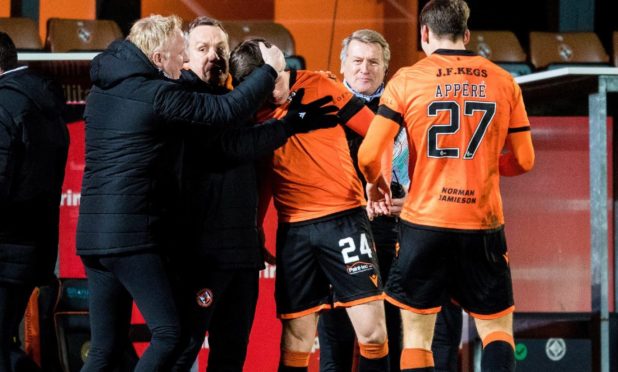 Micky Mellon and Lawrence Shankland celebrate.