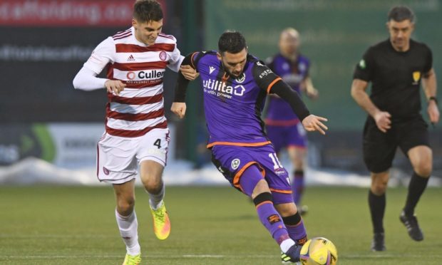 Nicky Clark shields the ball from Hamilton's Ben Stirling.