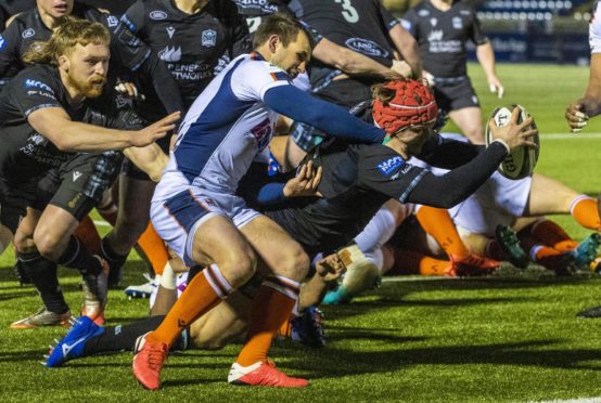 Geoiirge Taylor dives in for Glasgow's second try.