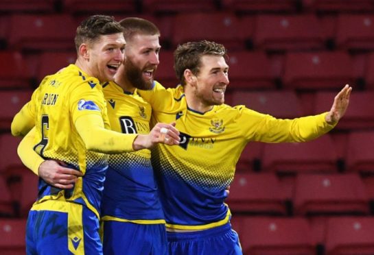 Liam Gordon celebrates with Shaun Rooney and David Wotherspoon.