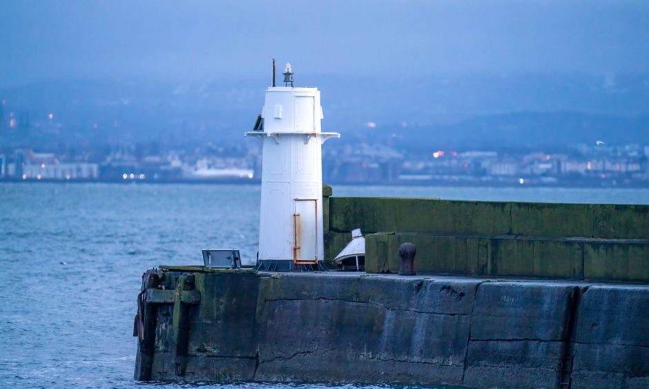 The lighthouse without its lantern after being struck by a Russian ship as it left Burntisland Harbour.