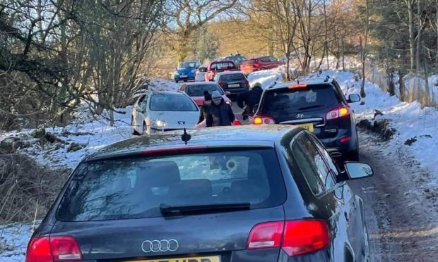 Police had to be called to clear the road at the Fife beauty spot after it was besieged with visitors despite the lockdown.