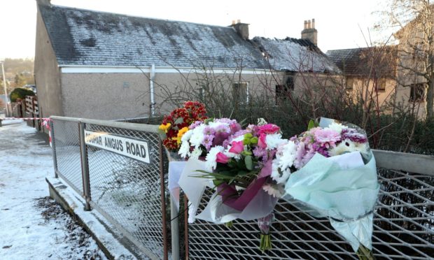 Flowers and birthday cards left at the scene