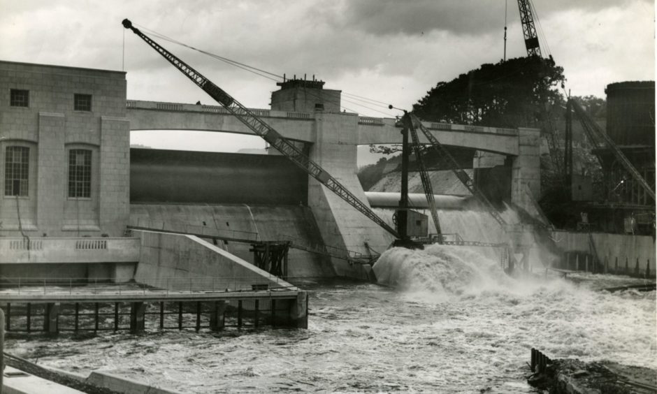 Water pours through the flood gates at Pitlochry Dam in August 1950, the year before it officially opened in 1951.