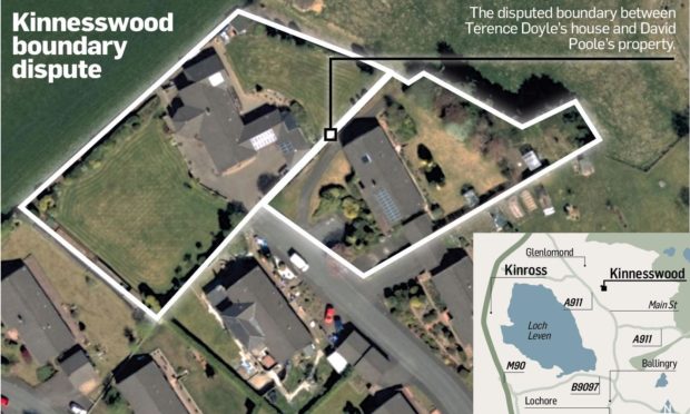 The disputed boundary line between Terence Doyle's and David Poole's properties.