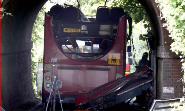 The scene on Well House Lane in Winchester after a school bus crashed into a railway bridge in September 2020.