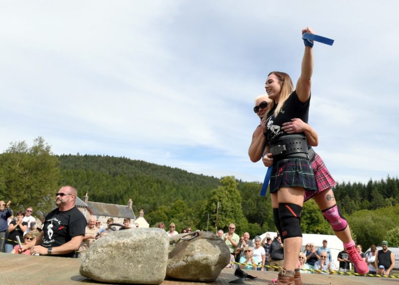 Leigh Holland-Keen celebrates after becoming only the second woman to lift the Dinnie Steens.