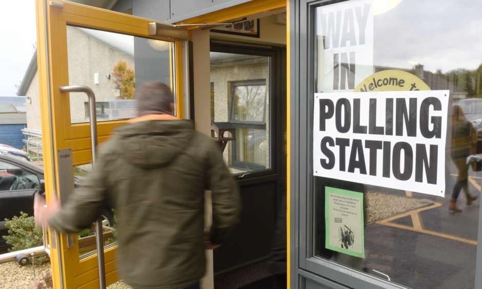 A voter enters a polling station.