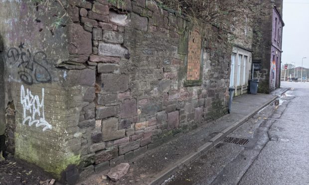 The stone, seen at the bottom of this image, fell on to the pavement