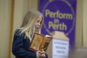 Erin Fox from St Leonards reads from "How to train your garden" by Cressida Cowell at Perform in Perth 2019.