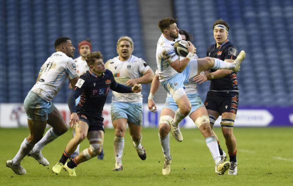 Ali Price collects the high ball under pressure at Murrayfield.