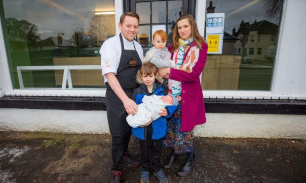 David Barnett and family -- his partner Marie Schade-Weskott holding Sophie (aged one) and sons William (aged six) holding Joseph (aged one month) at the Blasta Takeaway, 11 Perth Road, Stanley.