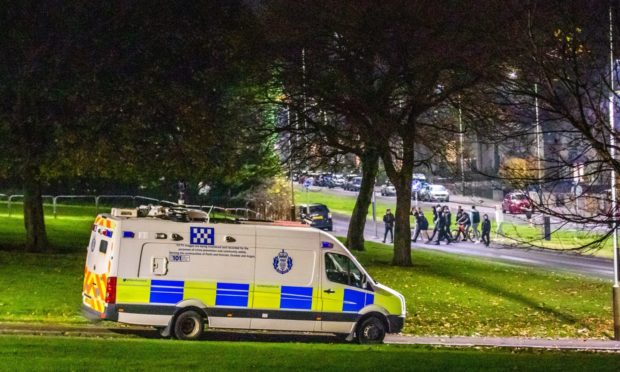 Police speaking to people in the Kirkton area of Dundee on Bonfire Night