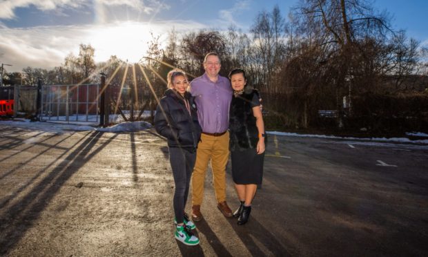 Fergus, Isara  and daughter Mia McCallum at the site where they hope to build the restaurant