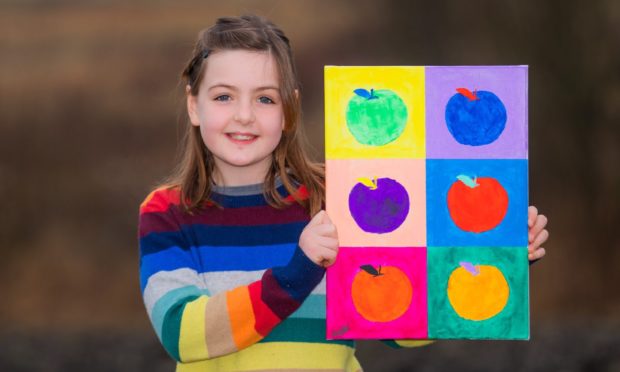 Elloise Tweddle with her painting for CHAS.