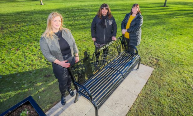 Sisters (left to right) Krystina Main, Karen Easton and Mhairi Cairns with the tribute bench - Jim Easton was their grandfather.