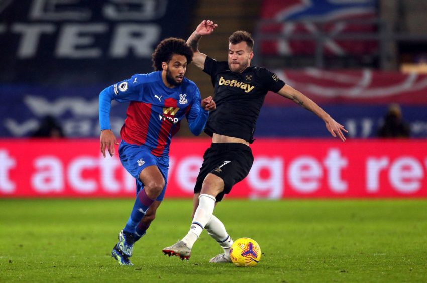 Crystal Palace's Jairo Riedewald (left) and West Ham United's Andriy Yarmolenko battle for the ball during Premier League match.