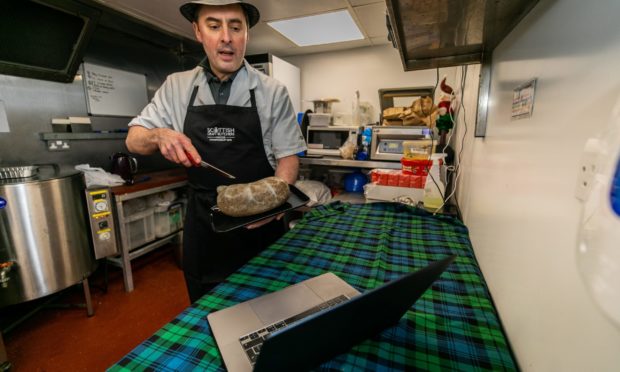 Butcher Tom Courts prepares to zoom in to Fridays Burns supper.