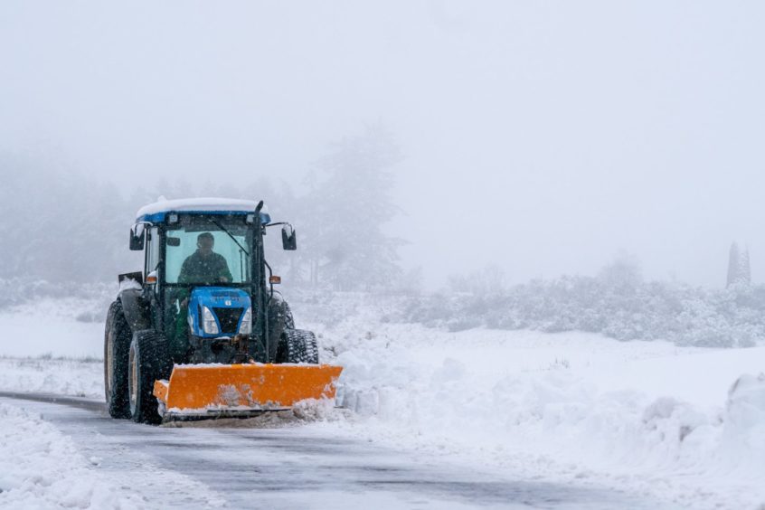 Tractors help keep the A823 clear near to Gleneagles.