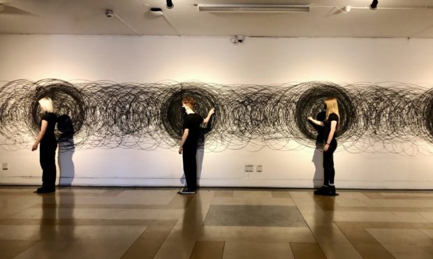 Visitors participating in You are It at Dundee University's Cooper Gallery during the Trinity Buoy Wharf drawing prize exhibition.