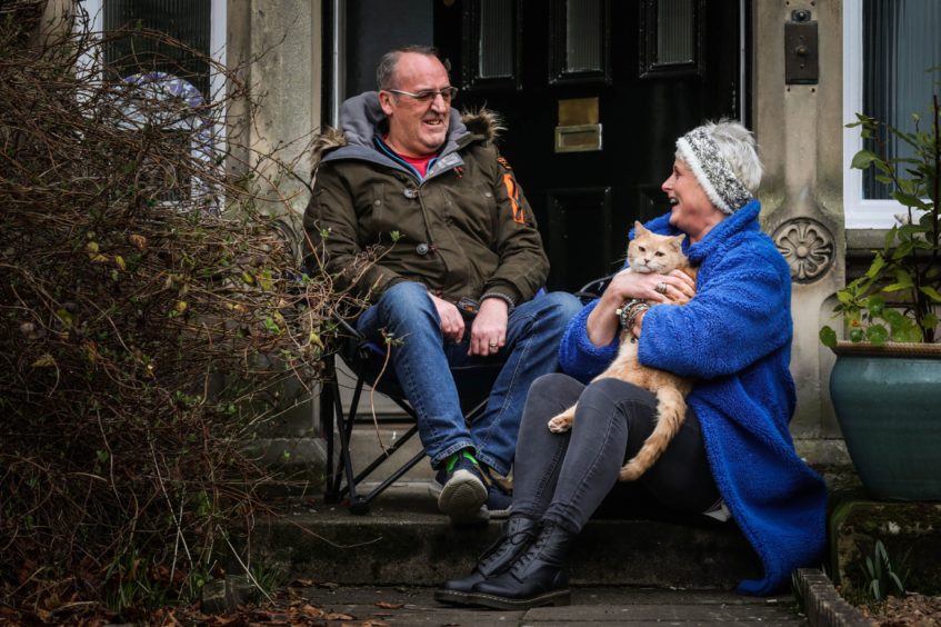 Dawn and Graham Allan at home in Newport with their cat Zambers McBambers.  Mhairi Edwards/DCT Media.