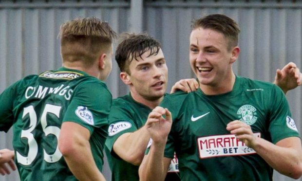 22/11/14 SCOTTISH CHAMPIONSHIP DUMBARTON V HIBERNIAN BET BUTLER STADIUM - DUMBARTON Goalscorer Scott Allan (right) is congratulated from team-mates Jason Cummings (left) and Lewis Stevenson as he puts Hibernian ahead.