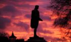 Sunrise over the Robert Burns statue at Union Terrace in Aberdeen.