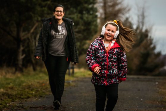 Emoke and Isabelle Matheson get some practice in for their walks at Neil's favourite spot beside their house.