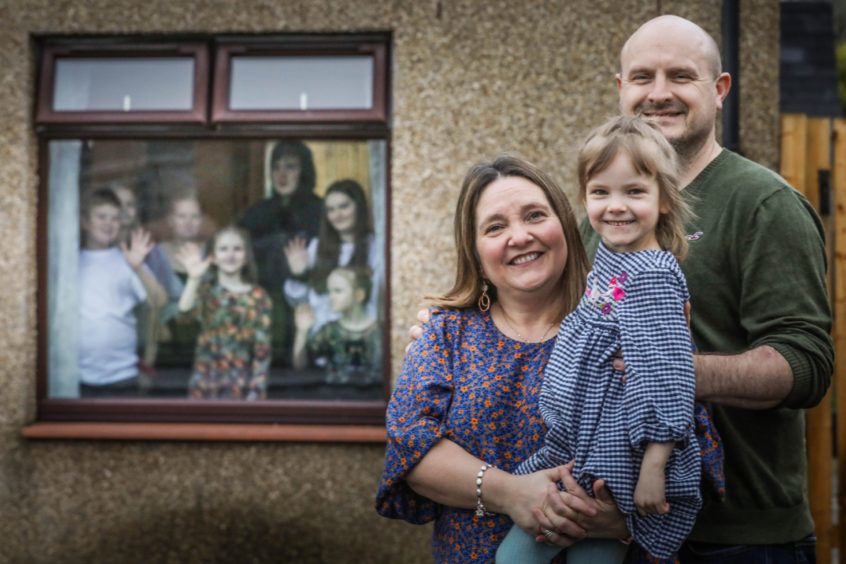 Emma, Meg and Roy Hann with some of their other 13 kids inside the house during lockdown. Mhairi Edwards/DCT Media