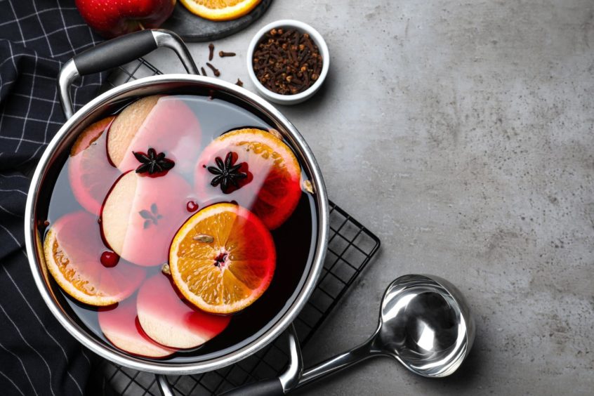 photo shows mulled wine warming in a pan.