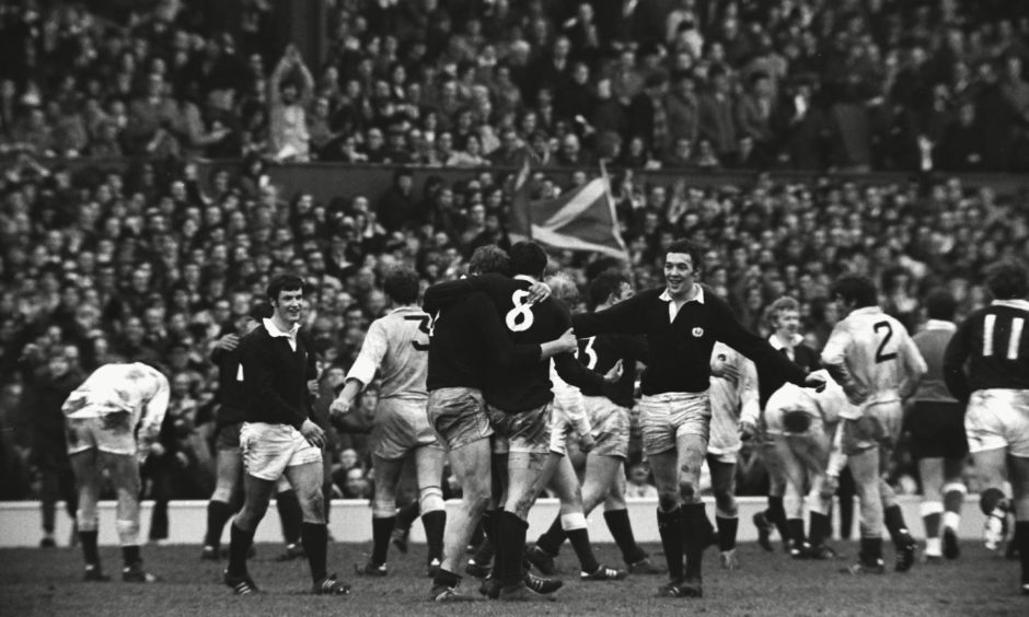 Scotland's Alistair McHarg celebrates with Peter Brown after victory in 1983 at Twickenham.