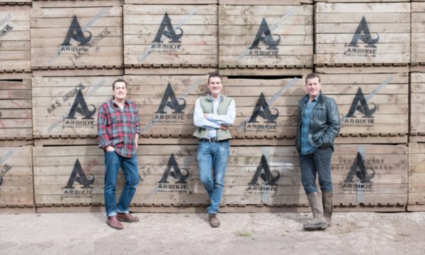 Iain Stirling, left, with his co-owner brothers John and David from Arbikie Distillery.