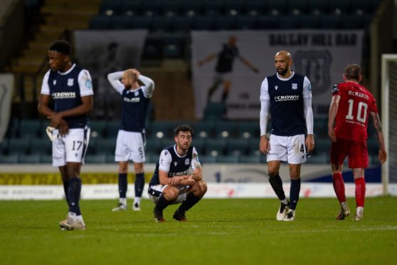 Dundee players dejected at full-time as they drew 3-3 with Dunfermline after leading 3-0.