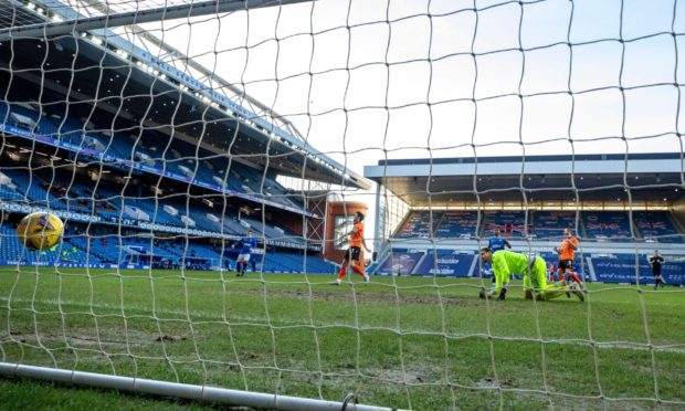 Benjamin Siegrist despairs as the ball trundles home off Alfredo Morelos.