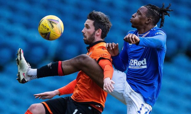 Dundee United hitman Nicky Clark and Rangers midfielder Joe Aribo battle for possession at Ibrox last weekend.