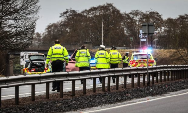 Police at the scene on the A90.