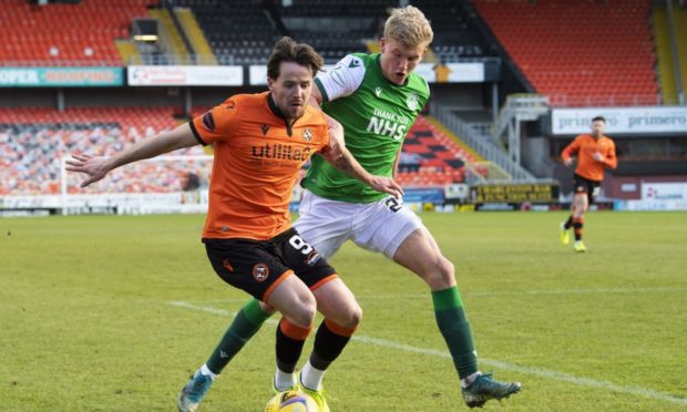 Marc McNulty and Hibs' Josh Doig battle for possession on Saturday.